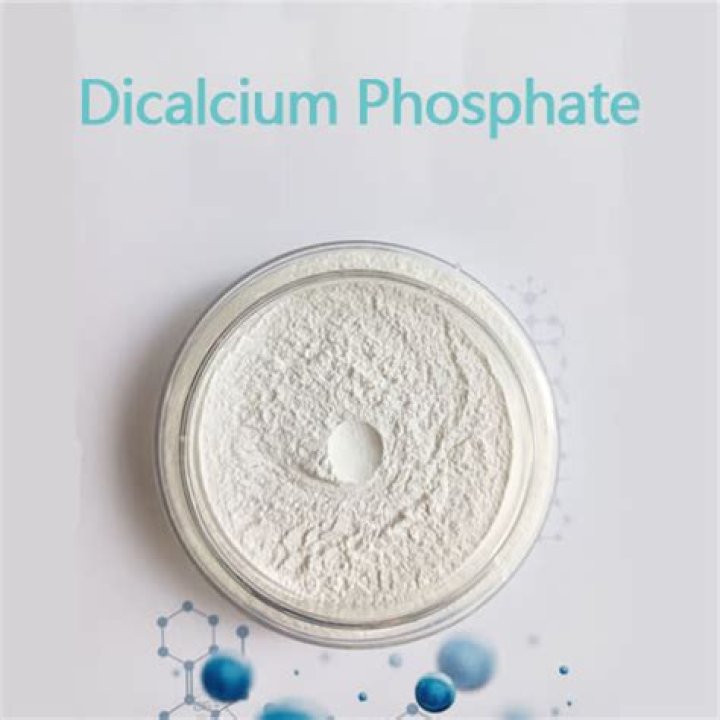 How is dicalcium phosphate produced?