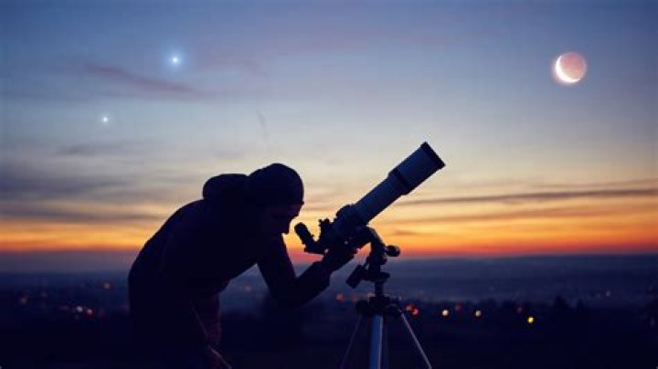When do astronomers use telescopes?